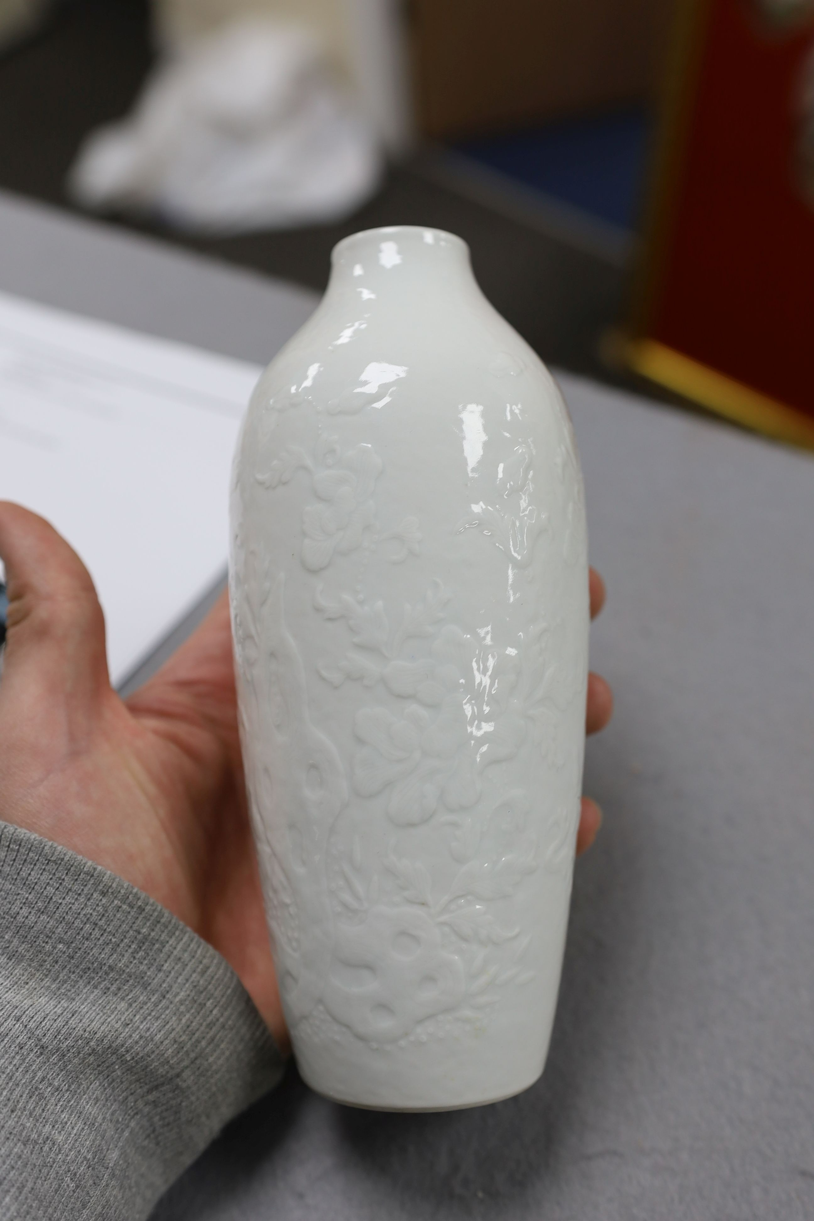 A Chinese moulded white glazed vase, Qianlong period, 18.3cm high, glaze blemish